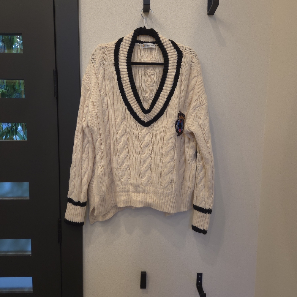 Elegant V-Neck Sweater with Black Accents